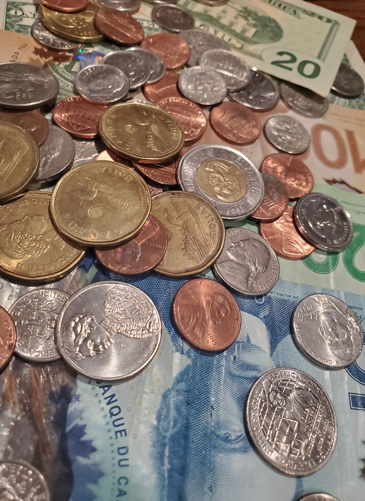 A close-up of Canadian and American currency